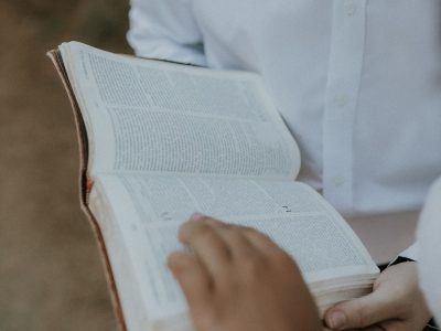 a person holding a book in their hands